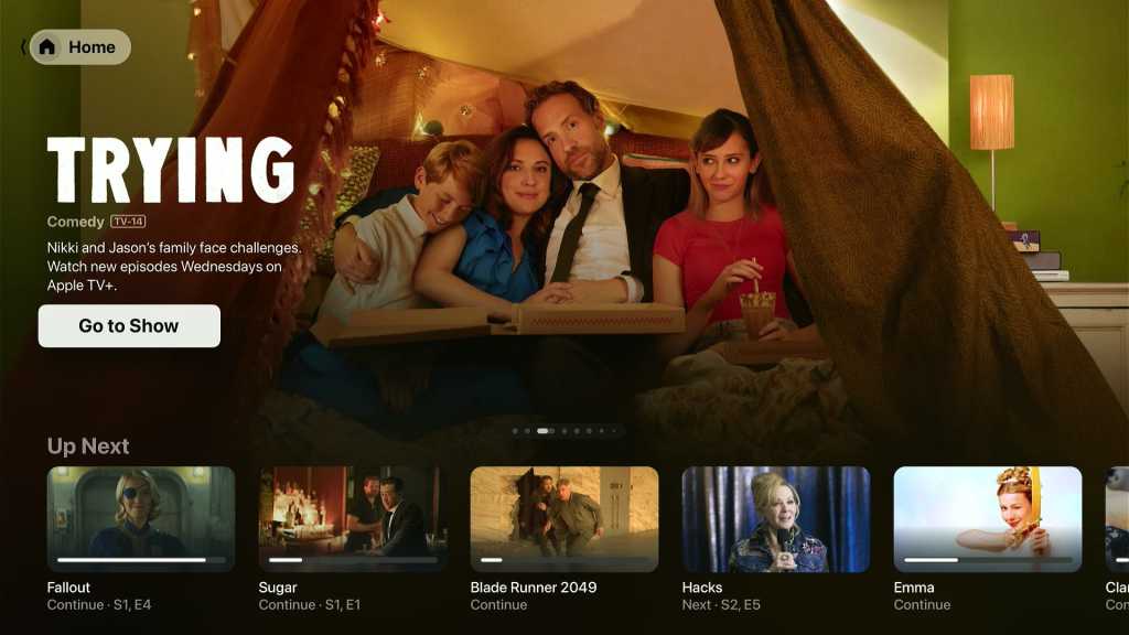 The Apple TV app showing a feature carousel and "Up Next" row