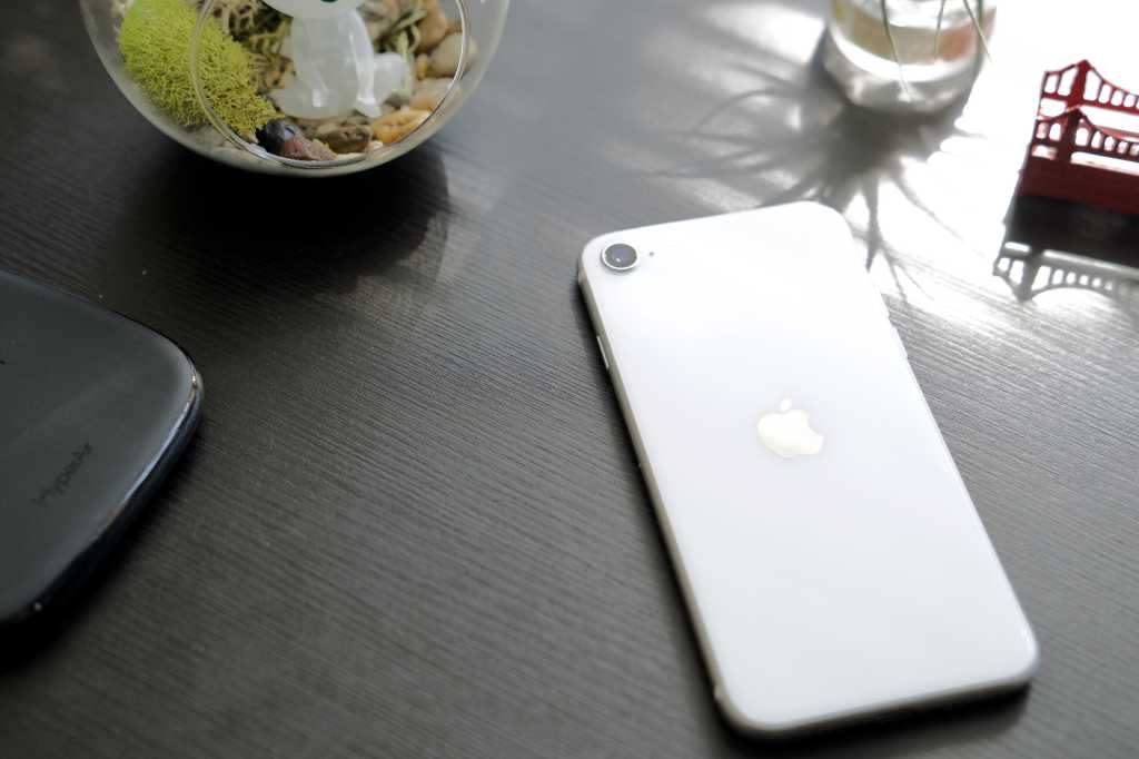 iPhone SE 2020 resting on a table in sunlight